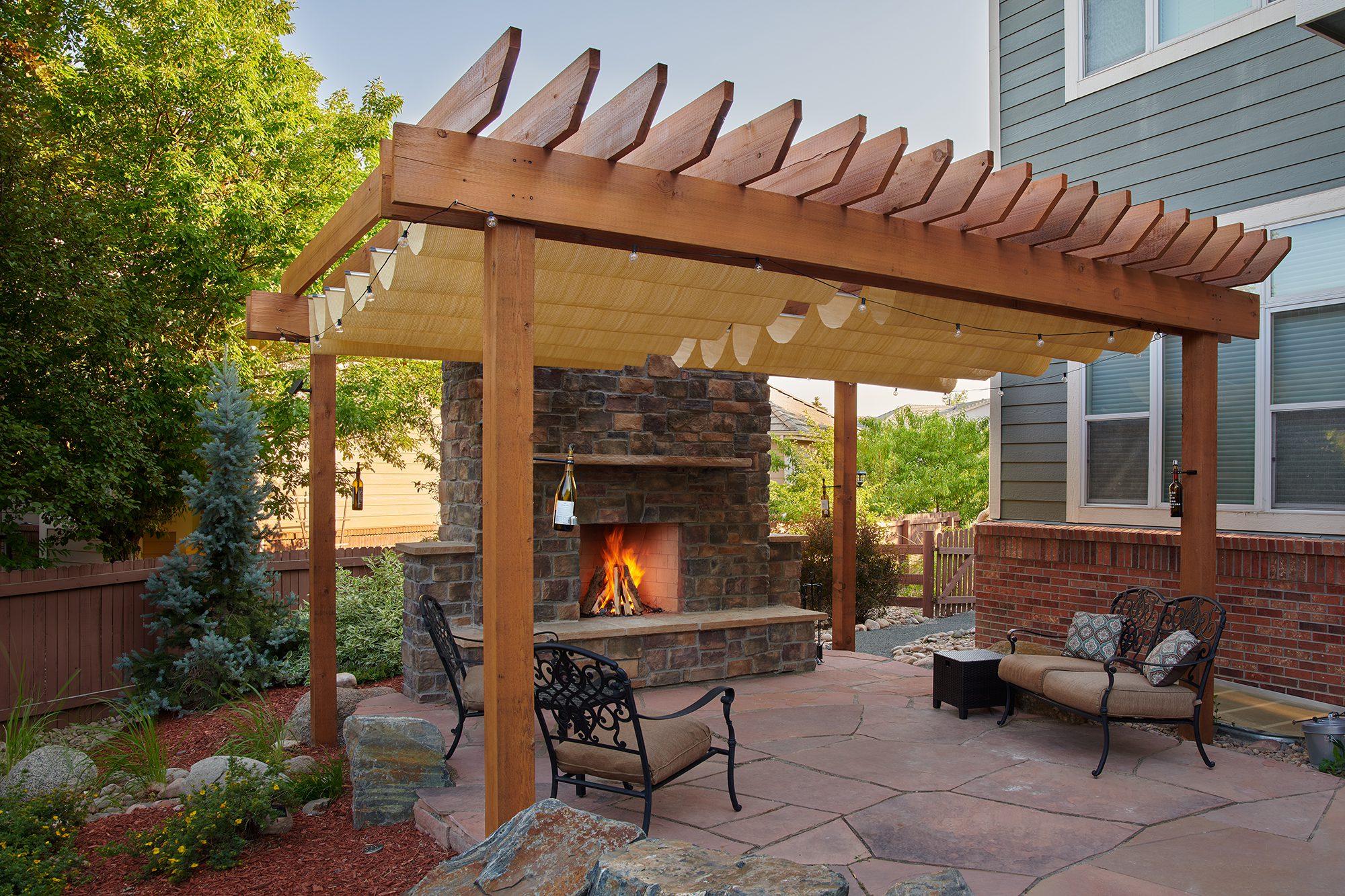 Pergola and outdoor fireplace with expert masonry work in Highlands Ranch, CO