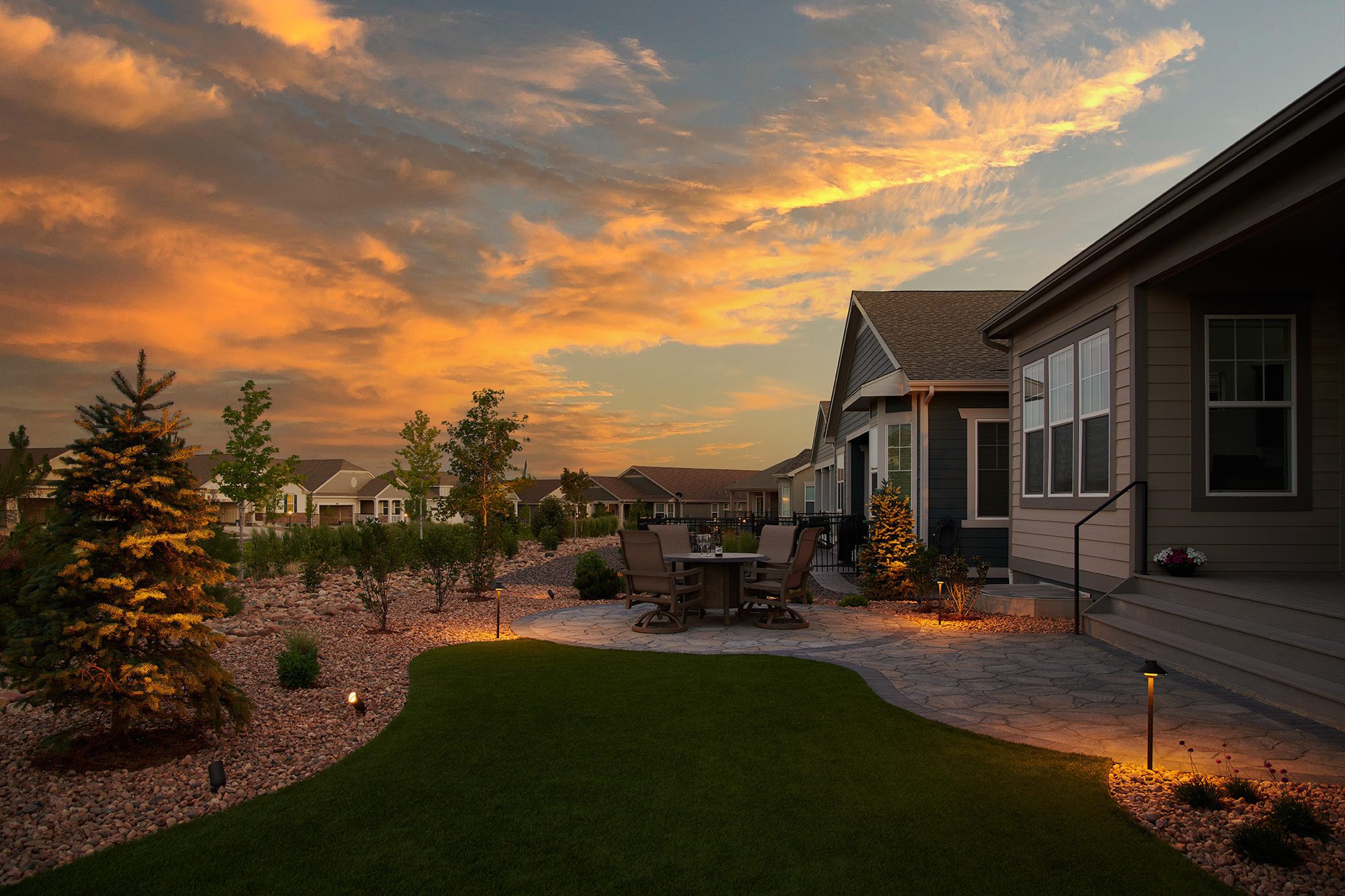 Landscape design with patio and outdoor lighting in Greenwood Village, Colorado