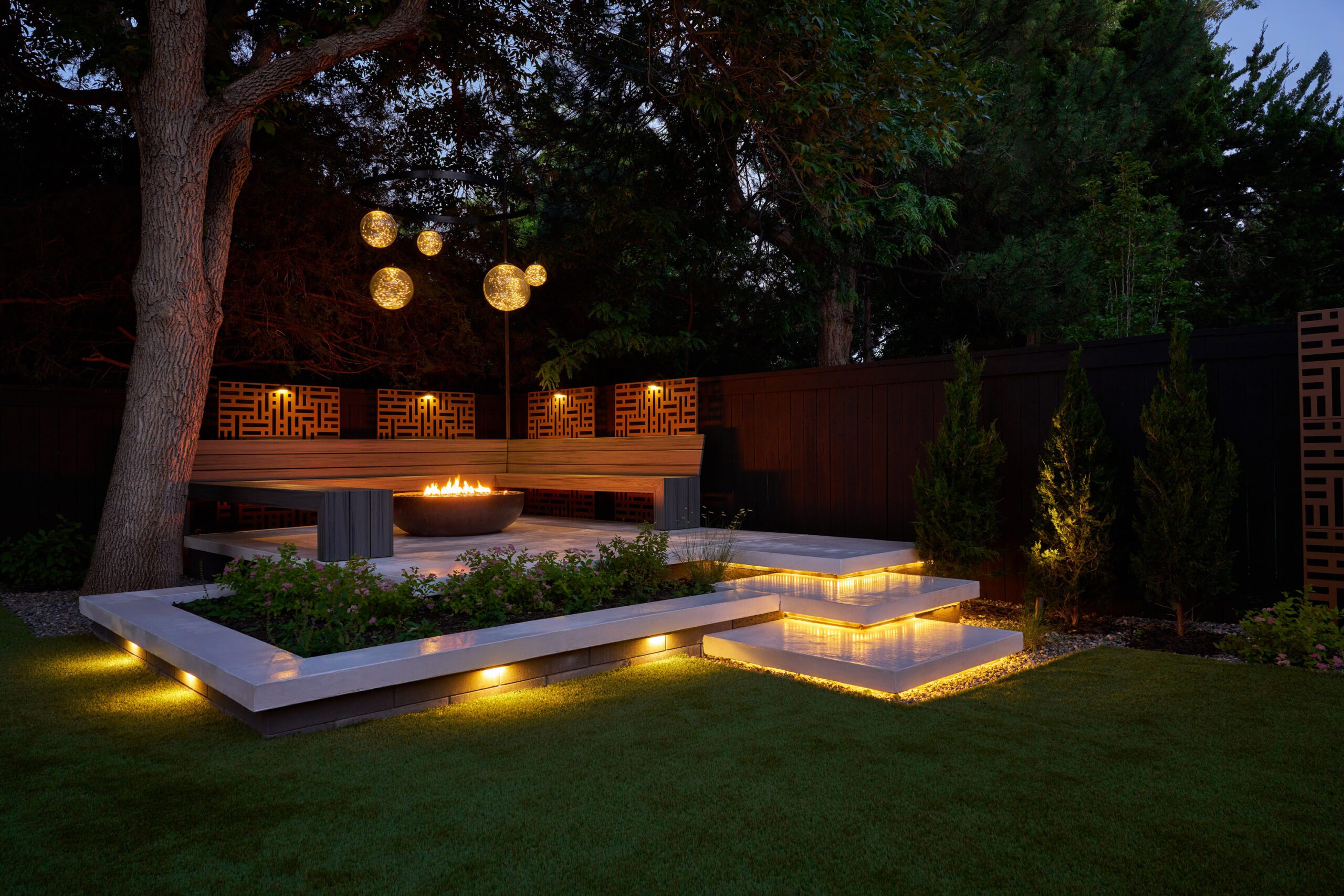Landscape design with patio and outdoor lighting in Greenwood Village, Colorado